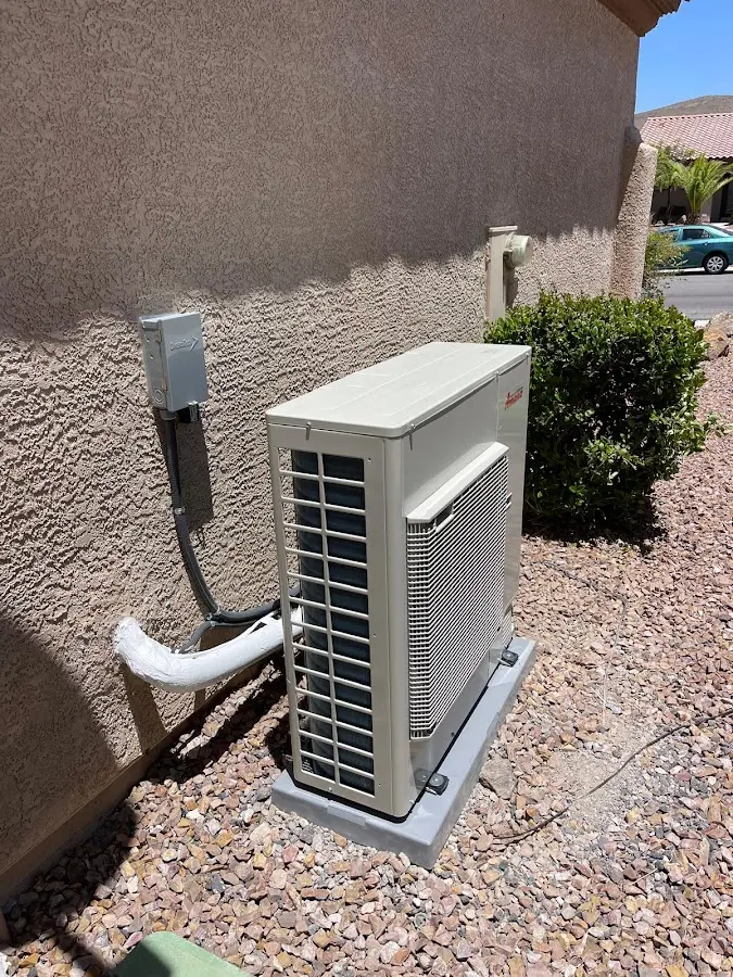 Residential air conditioning condenser unit in Eastman